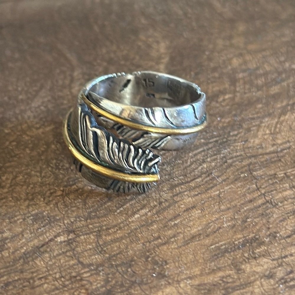 Beautiful sterling silver ring with gold banding. Handmade by SAAD.